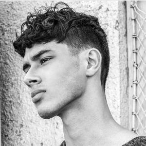 Wavy Style Textured Top  haircut for men with big foreheads